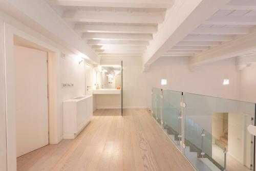 a room with a hallway with a sink and a mirror at Le Grazie Luxury Apartment in Florence