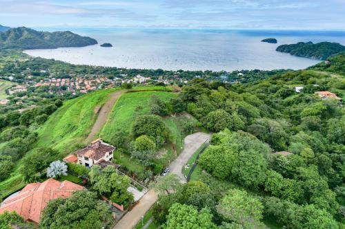 an aerial view of a house on a hill near the water at Casa Gerónimo in Playa Hermosa