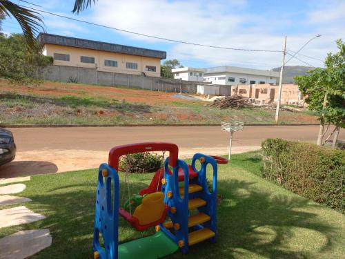 a playground with a slide in the grass at Casa Capitolio in Capitólio