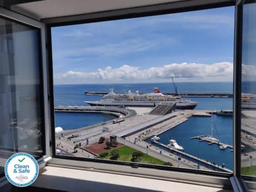 a cruise ship is docked at a harbor at Paradise Stunning Views - Best Location on Island in Ponta Delgada