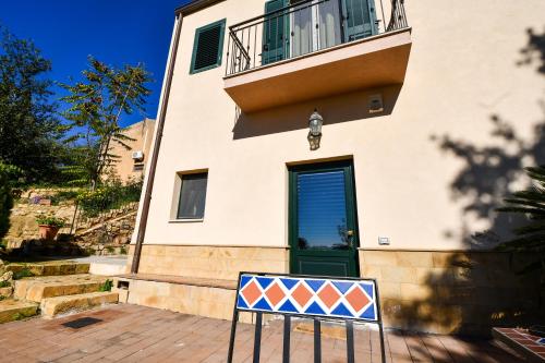 a house with a sign in front of it at Dream House in Piazza Armerina