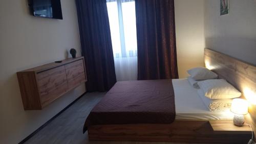 Postel nebo postele na pokoji v ubytování MAFA Hotel
