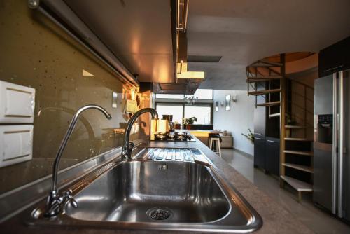 a kitchen with a stainless steel sink in a kitchen at VillaBayViewCrete in Hersonissos