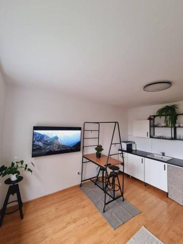 a kitchen with a counter and a table in a room at -NEW-Rosetta Apartment in Piešťany