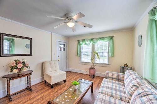 a living room with a couch and a table at Charming Beaufort Getaway Walk to the Waterfront! in Beaufort