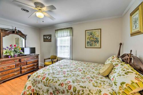 a bedroom with a bed and a ceiling fan at Charming Beaufort Getaway Walk to the Waterfront! in Beaufort