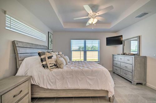 a bedroom with a bed and a ceiling fan at Home in The Villages Golf Cart and Amenity Access in Wildwood