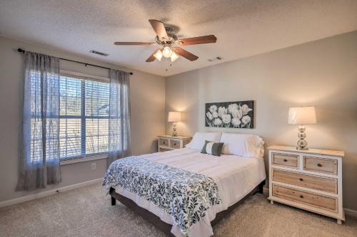 a bedroom with a bed and a ceiling fan at Charming Newnan Getaway about Mins to Downtown! in Newnan