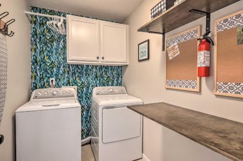 a kitchen with a washer and dryer and a counter at Charming Newnan Getaway about Mins to Downtown! in Newnan