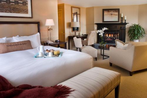 a hotel room with a bed with a tray of food on it at Lambertville Station Inn in Lambertville