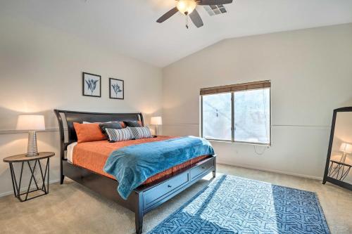 a bedroom with a bed and a window at Avondale Home with Pool, 5 Mi to State Farm Stadium! in Avondale