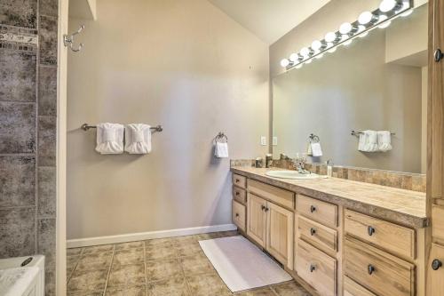a bathroom with a sink and a mirror at Spacious Fraser Condo about 6 Mi to Winter Park! in Fraser