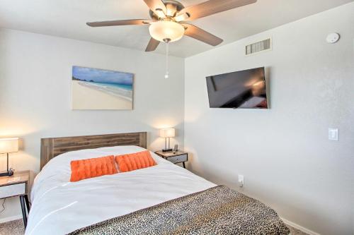a bedroom with a bed and a ceiling fan at Vibrant, Colorful Tucson Abode w/ Pool & Hot Tub in Tucson