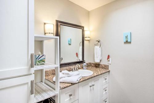 a bathroom with a sink and a mirror at Vibrant, Colorful Tucson Abode w/ Pool & Hot Tub in Tucson