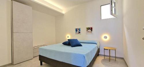 Säng eller sängar i ett rum på Villa Taliala