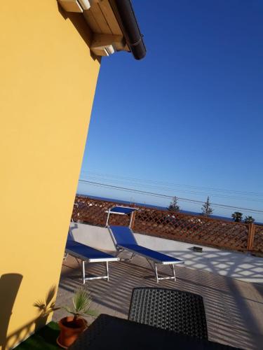 a group of chairs sitting on top of a patio at Appartamento Domenico in Lampedusa