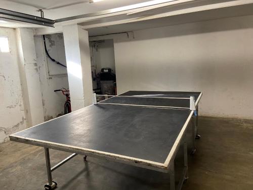 a room with a ping pong table in it at Les Oliveres - casa- apartament in Vilafant