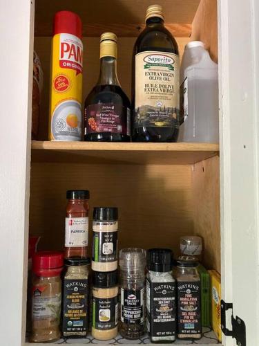a pantry filled with lots of bottles of alcohol at Modern Beach House long stay discounts in Sarnia