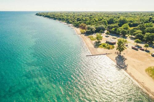 an aerial view of a beach and the ocean at Modern Beach House long stay discounts in Sarnia