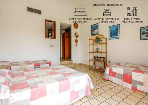 Ένα ή περισσότερα κρεβάτια σε δωμάτιο στο Casa Fujiyama Relax y Alberca bajo el sol