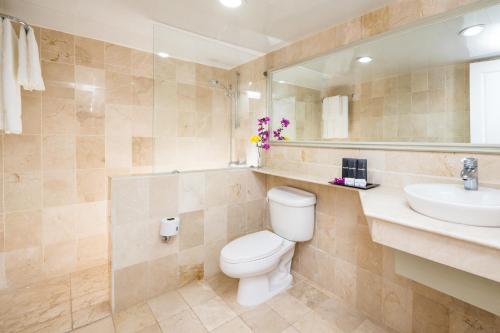 a bathroom with a toilet and a sink at BlueBay Villas Doradas Adults Only-All Inclusive in San Felipe de Puerto Plata