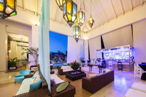 a large living room with couches and a table at BlueBay Villas Doradas Adults Only-All Inclusive in San Felipe de Puerto Plata