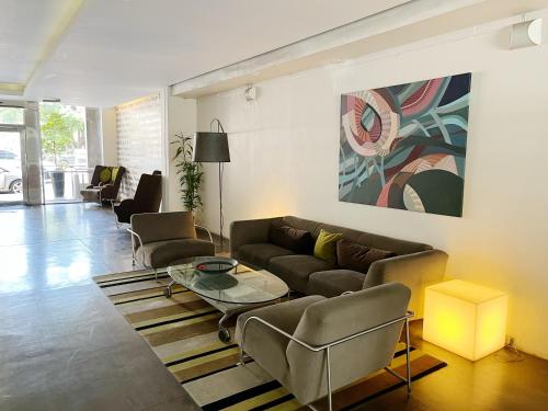 a living room with a couch and a table at Park Soho Recoleta in Buenos Aires