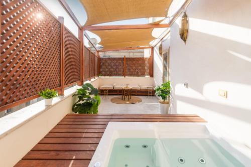 a room with a bath tub in the middle of a building at Marrakesh 1BDR w Jacuzzi Terrace Downtown Cairo in Cairo