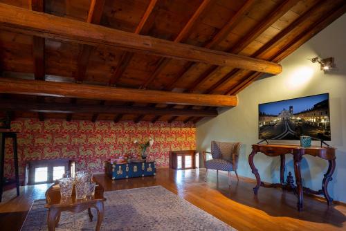 a living room with a tv on the wall at N°30 CHARME Apartments in Vigevano