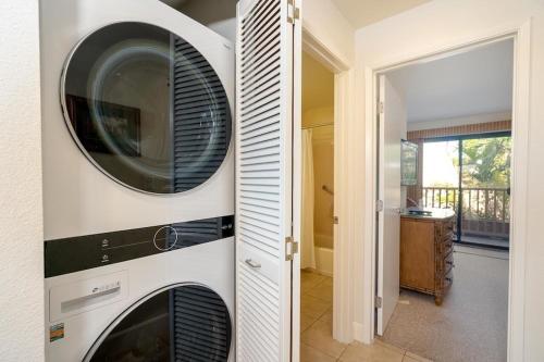 a kitchen with a washer and dryer in a house at Maui Kamaole B207 in Wailea