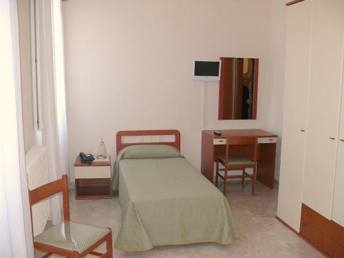 Postel nebo postele na pokoji v ubytování Albergo Casa Del Pellegrino