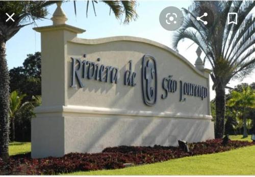 a sign for the rotunda office of a company at RIVIERA DE SAO LOURENÇO, CONDO ACQUA A 0,5 MIN DA PRAIA - estilo resort! Lindo apto com ar condicionado e wifi in Riviera de São Lourenço