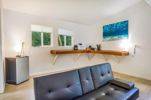a living room with a couch and a table at Puni Mauka B 31 plus day rental in Pahoa