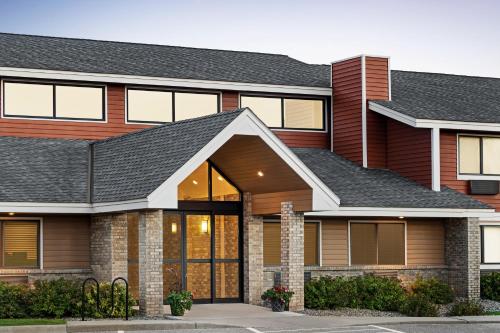 a rendering of a house at AmericInn by Wyndham Sauk Centre in Sauk Centre