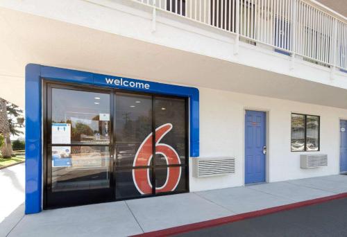 a welcome sign on the side of a building at Motel 6-Arcadia, CA - Los Angeles - Pasadena Area in Arcadia