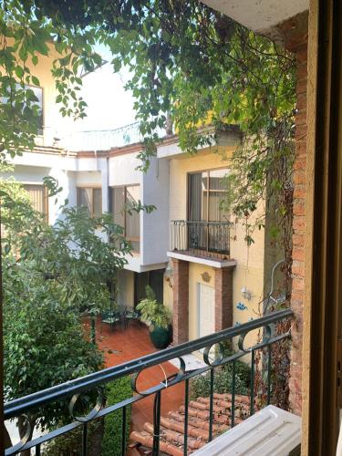 an outside view of a building with a balcony at Hotel Inn Galerias in Aguascalientes