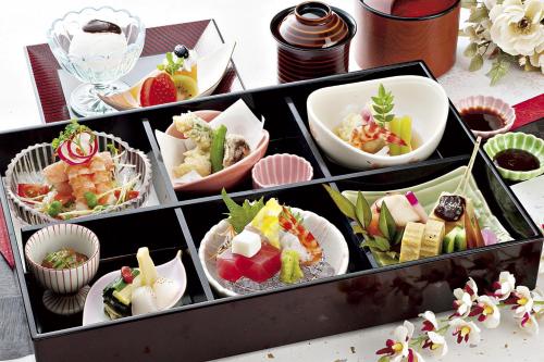 a tray of different types of food on a table at Okazaki New Grand Hotel in Okazaki