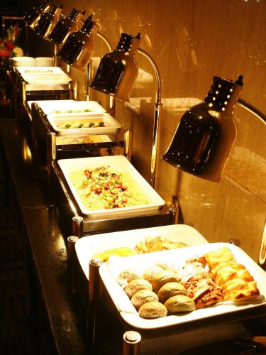 a row of trays filled with different types of food at Okazaki New Grand Hotel in Okazaki