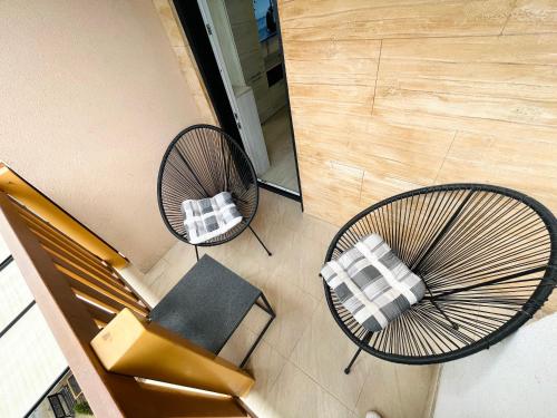 an overhead view of two chairs and a table at Apartmani SLEEP&JOY in Zlatibor