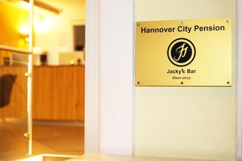 a sign for a hamker city pension on a wall at JJ Hotel Hannover-City-Pension in Hannover