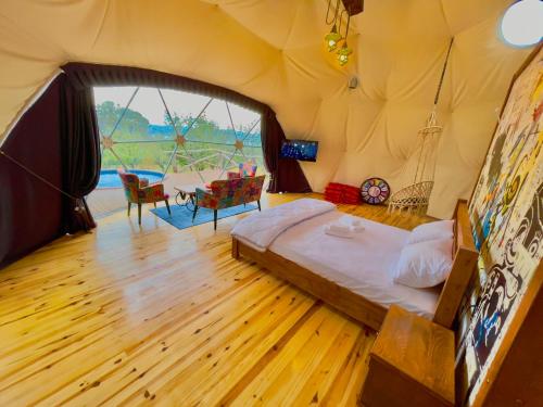 a bedroom with a bed in a tent at Sapanca Green Dome in Sapanca