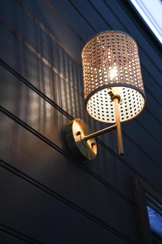 a lamp hanging on the side of a house at Tamworth Country Escape with a beautiful swimming pool! in Loomberah