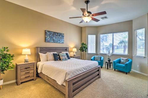 a bedroom with a bed and a ceiling fan at Goodyear Home on Golf Course Pool and Putting Green in Goodyear