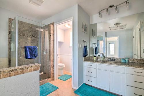 a bathroom with a shower and a sink at Sunny Lakefront Escape with Private Beach and Deck in Burnet