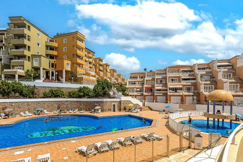 an image of a swimming pool at a apartment complex at Beautiful deluxe apartment Sun and Sea in Adeje