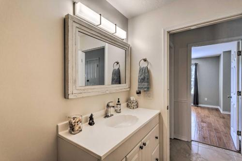a bathroom with a sink and a mirror at Sunshine State Escape 3 Mi to Navarre Beach! in Navarre