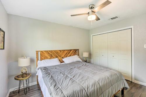 a bedroom with a bed and a ceiling fan at Pet-Friendly Lockhart Home with Private Yard! in Lockhart