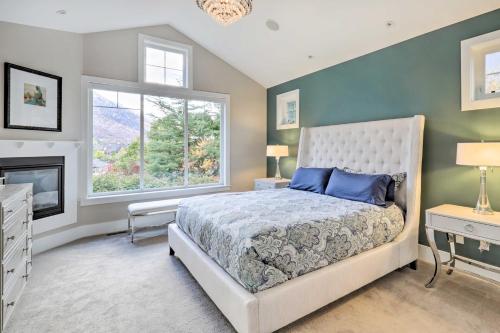 a bedroom with a large bed and a window at Luxe Sandy Home with Hot Tub 9 Mi to Skiing! in Sandy