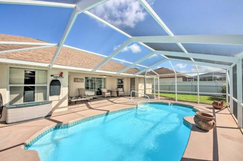 a large swimming pool with a retractable roof at Pool and Fenced Yard Sebring Retreat in Sebring