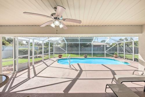 a patio with a pool and a ceiling fan at Pool and Fenced Yard Sebring Retreat in Sebring
